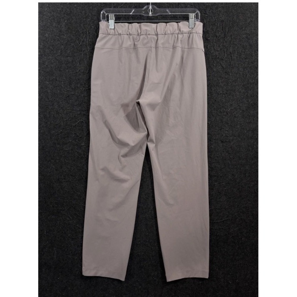 Vuori Miles Ankle Pants Women Small Beige Tapered Joggers Zip Pocket Performance